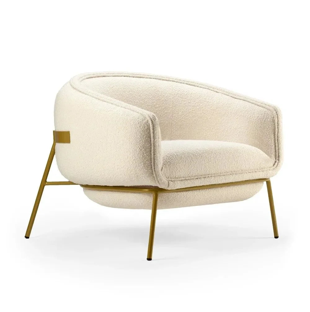Cream bouclé accent armchair on slim brass legs