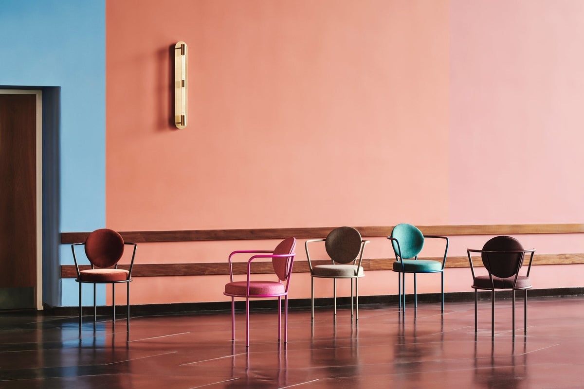 Colourful upholstered dining chairs by Maison Burgos