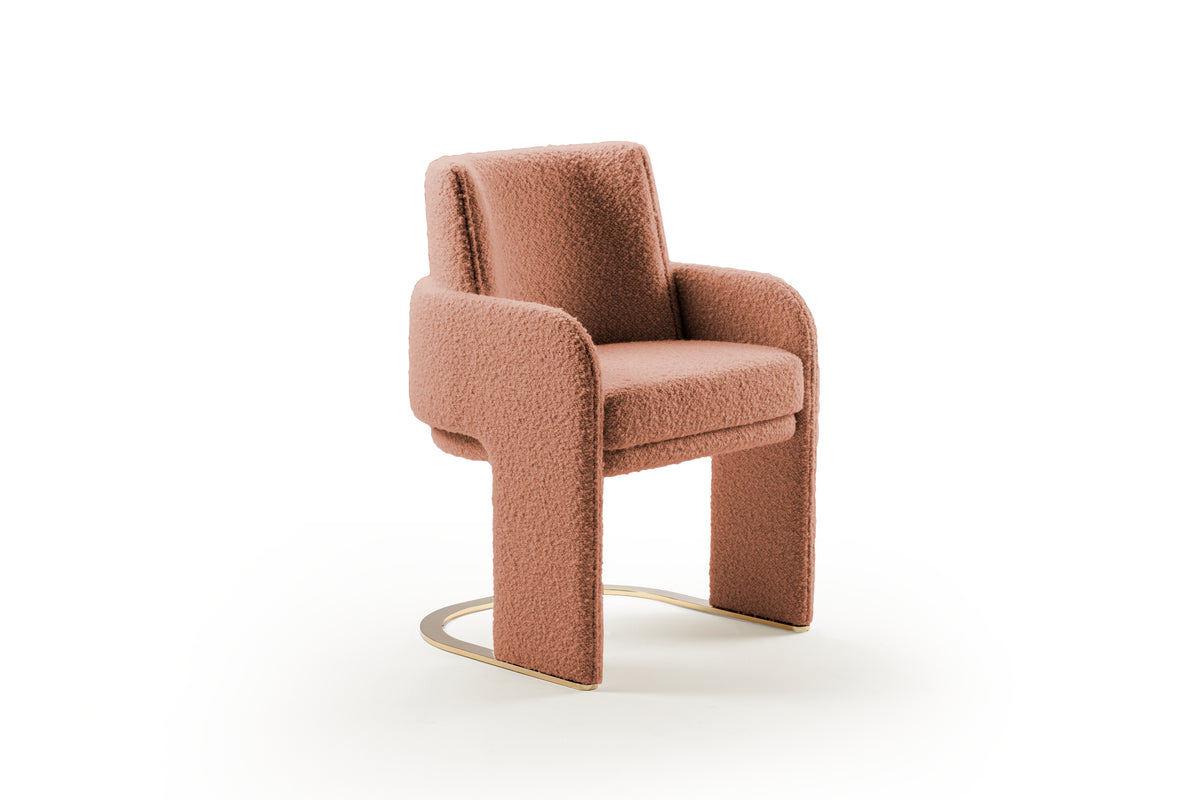 Odisseia Dining Chair in dusty pink bouclé, three-quarter view on white