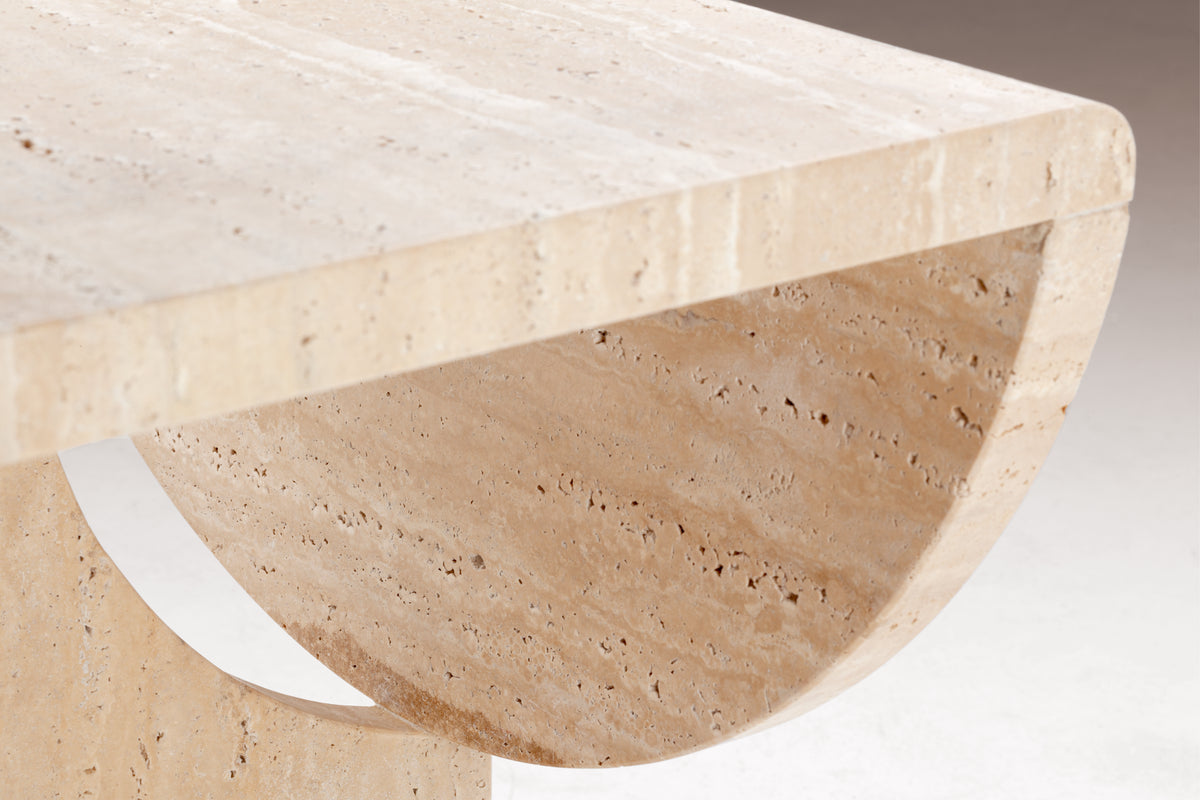 Playing Games Travertine Side Table close-up of the travertine top edge