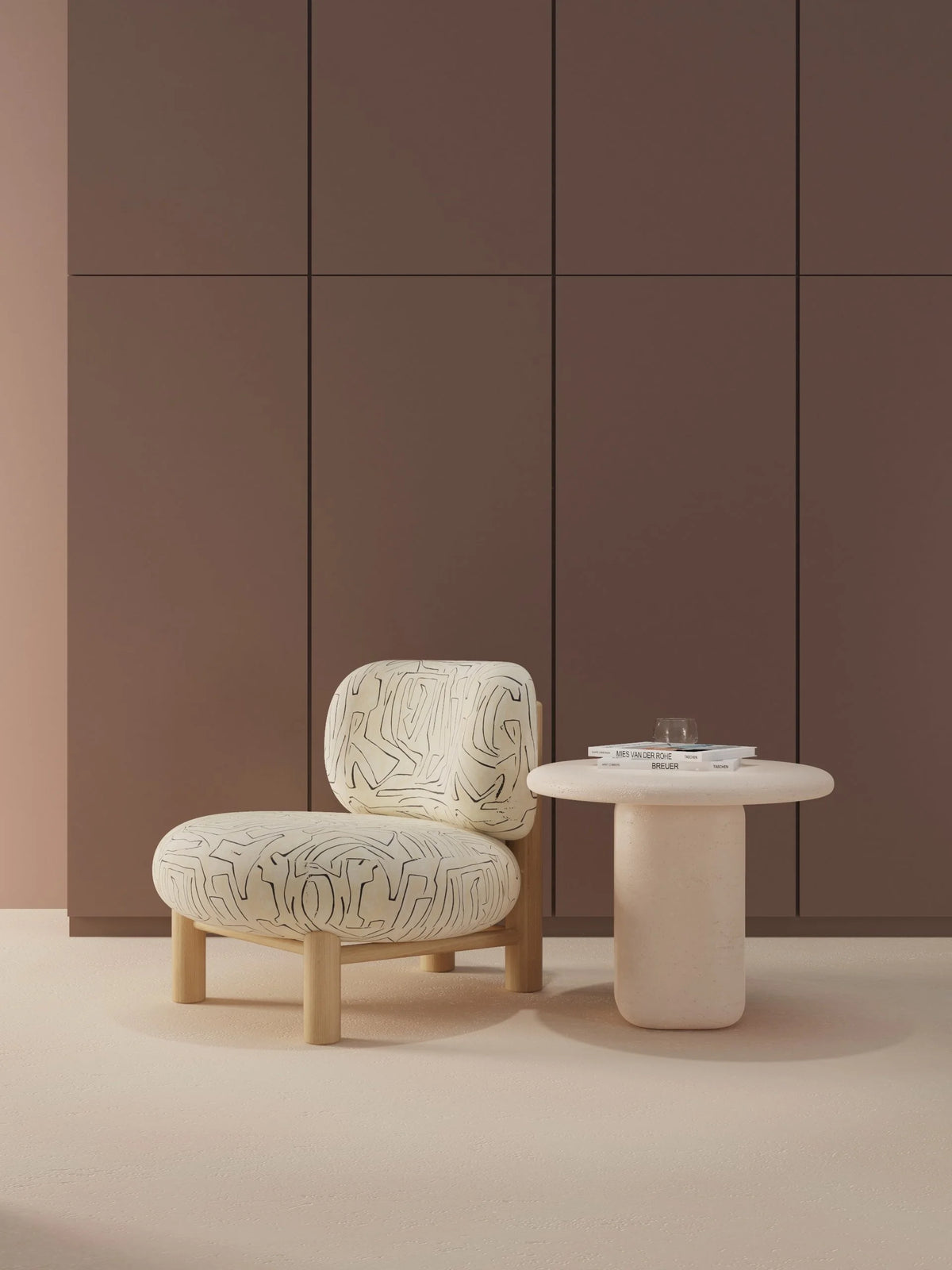 Aimi Lounge Chair in cream abstract fabric beside a round side table against a mauve wall