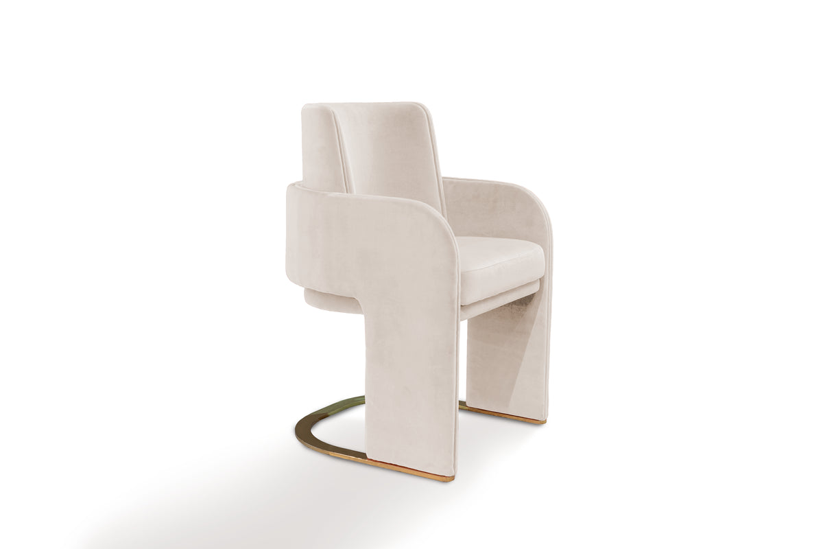 Odisseia Dining Chair in ivory velvet with brass sled base, three-quarter view