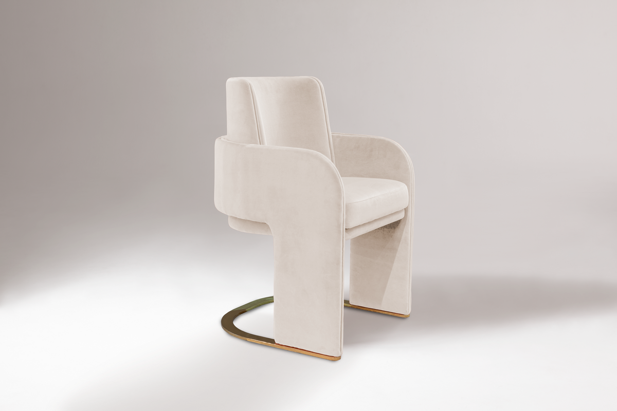 Odisseia Dining Chair in ivory velvet, three-quarter view on a grey backdrop