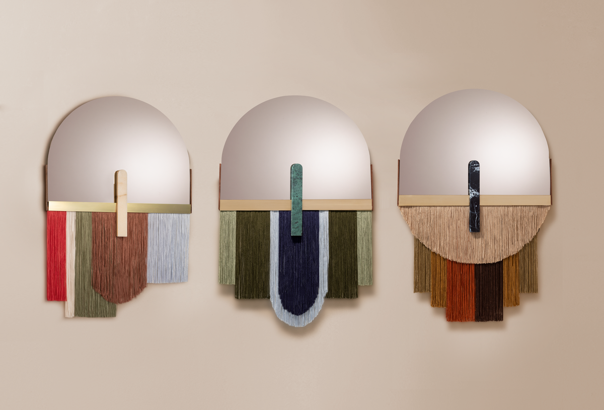 Souk Mirror Moss shown with papaya and caramel versions on a beige wall
