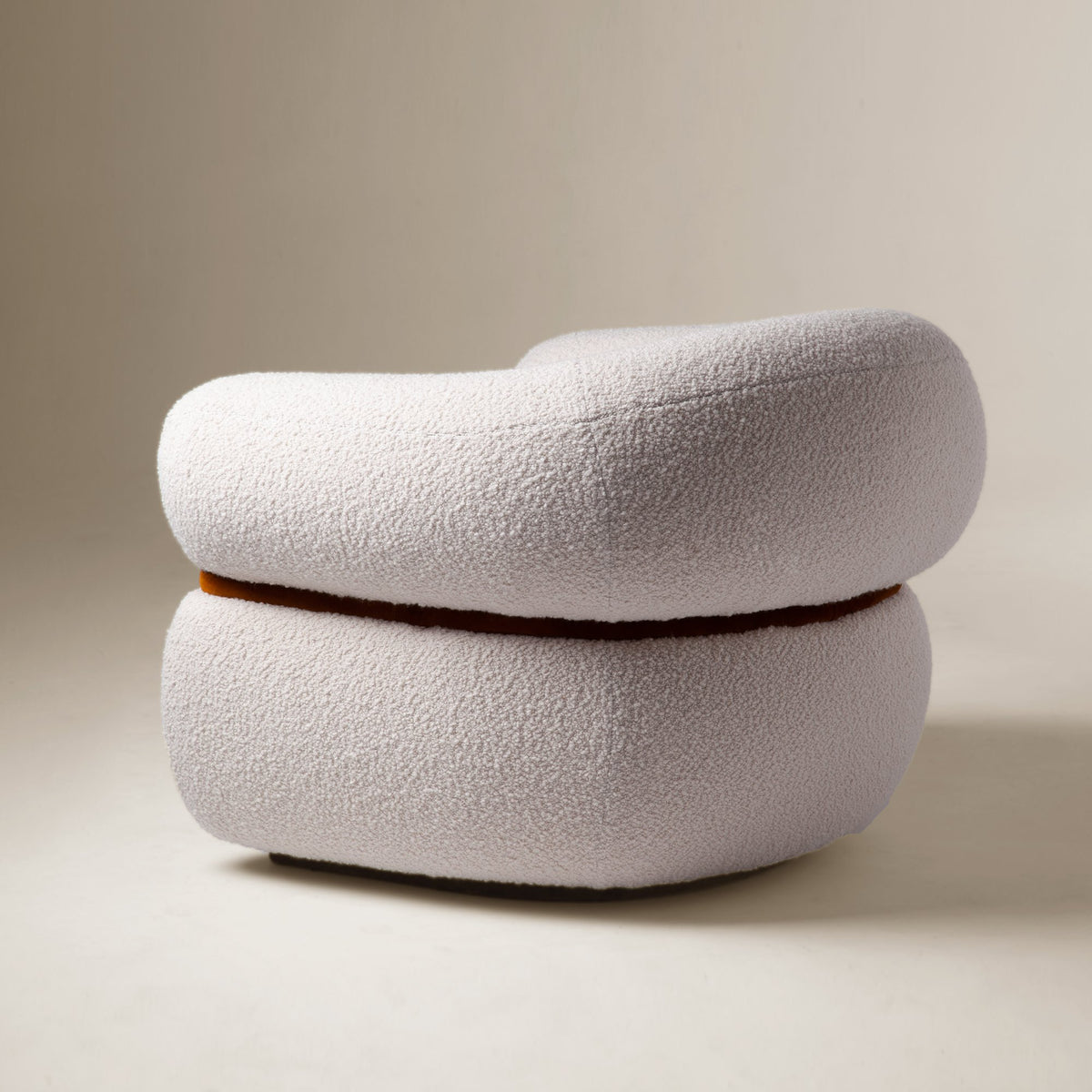 Malibu Armchair in ivory Bouclé with rust piping, side view