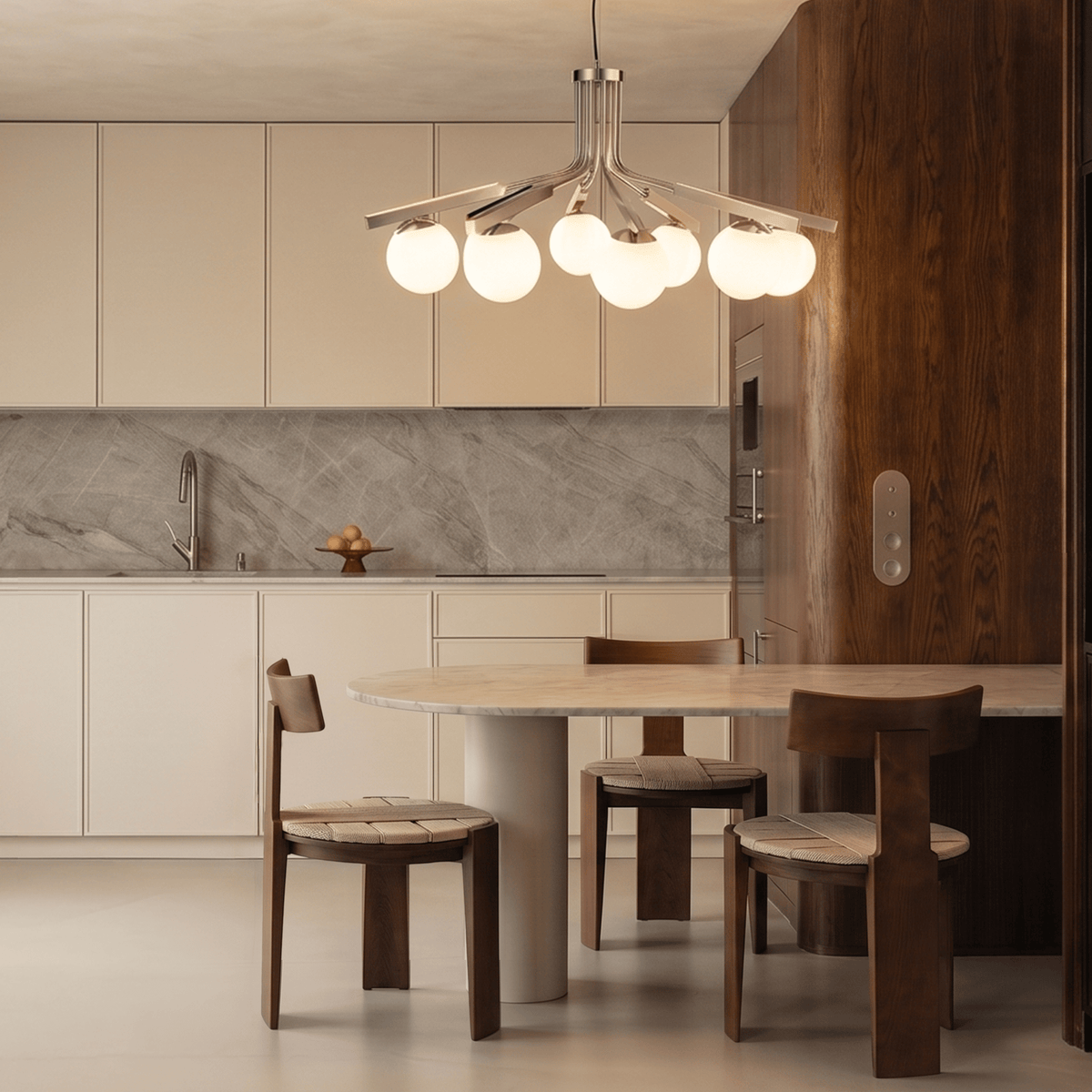 Nest Dining Chairs at a round table in a kitchen under a globe chandelier