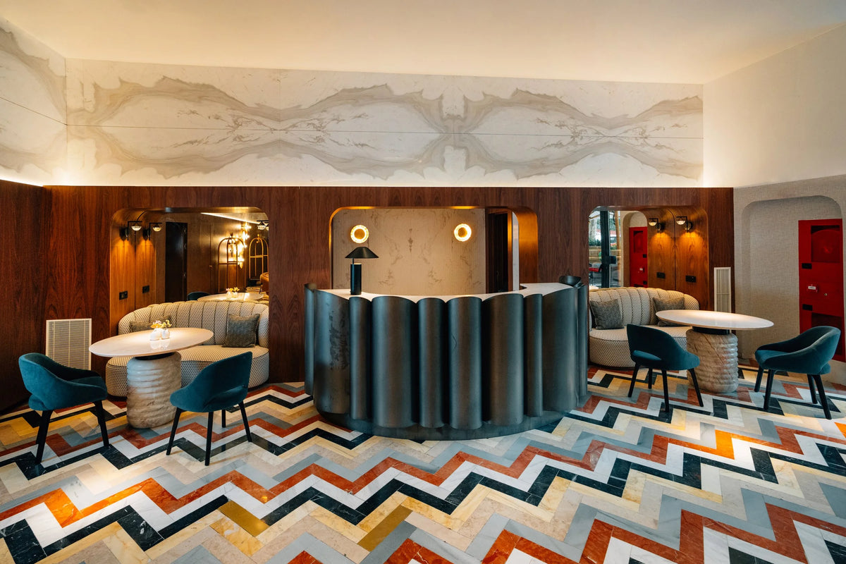 Jean Dining Tables in a dining room with zigzag tiles, wide view