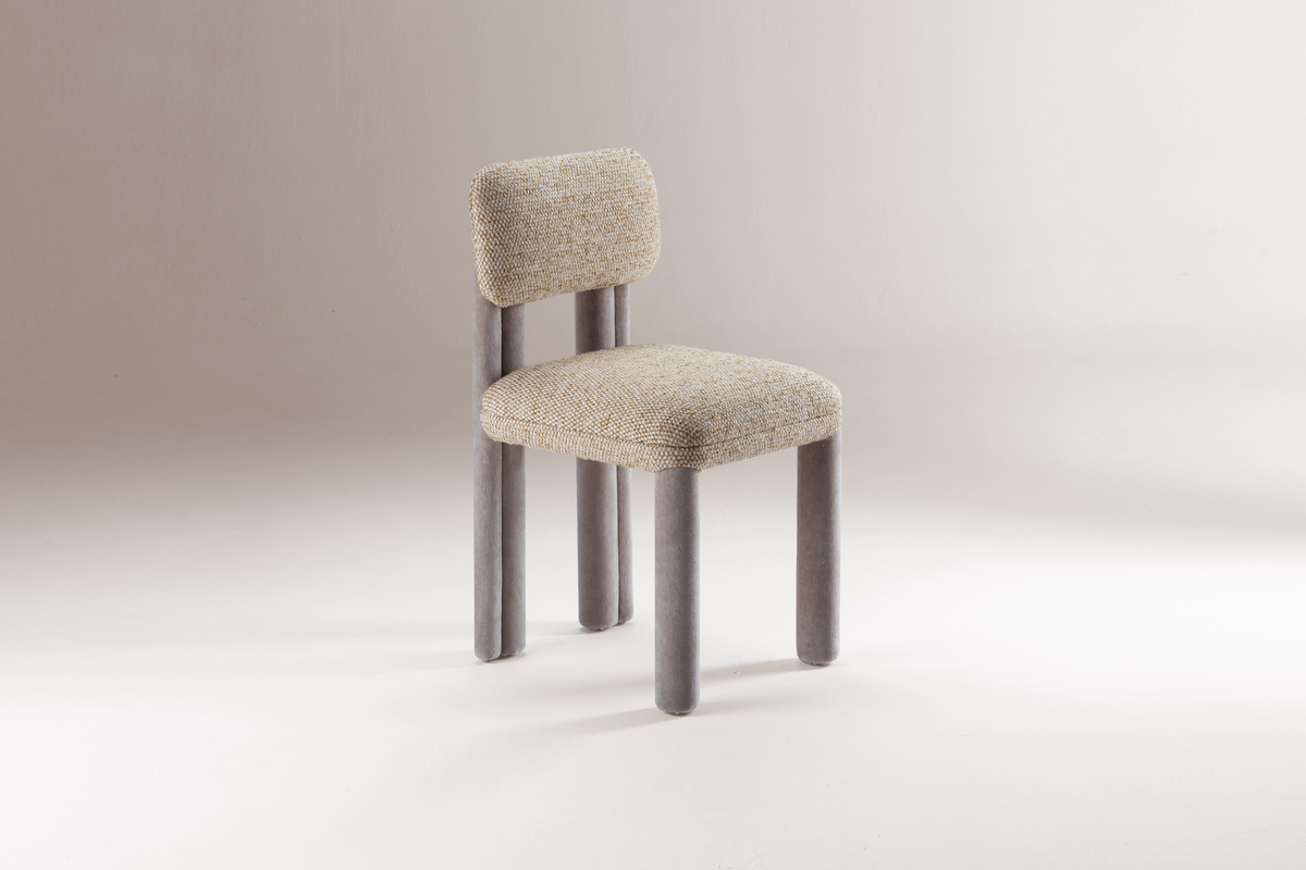 Camelia Dining Chair in oatmeal bouclé with grey legs, front three-quarter view