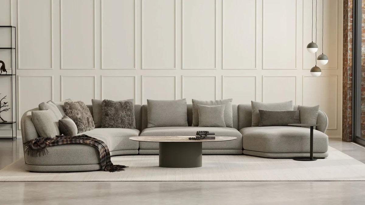Argon Coffee Table in a grey living room with a curved modular sofa