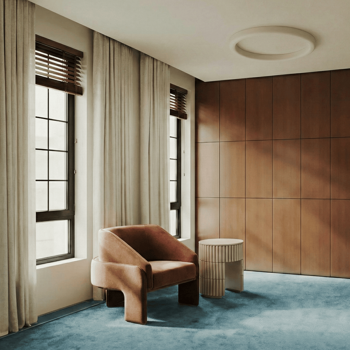Nouvelle Vague Side Table beside a terracotta armchair in a room with teal carpet