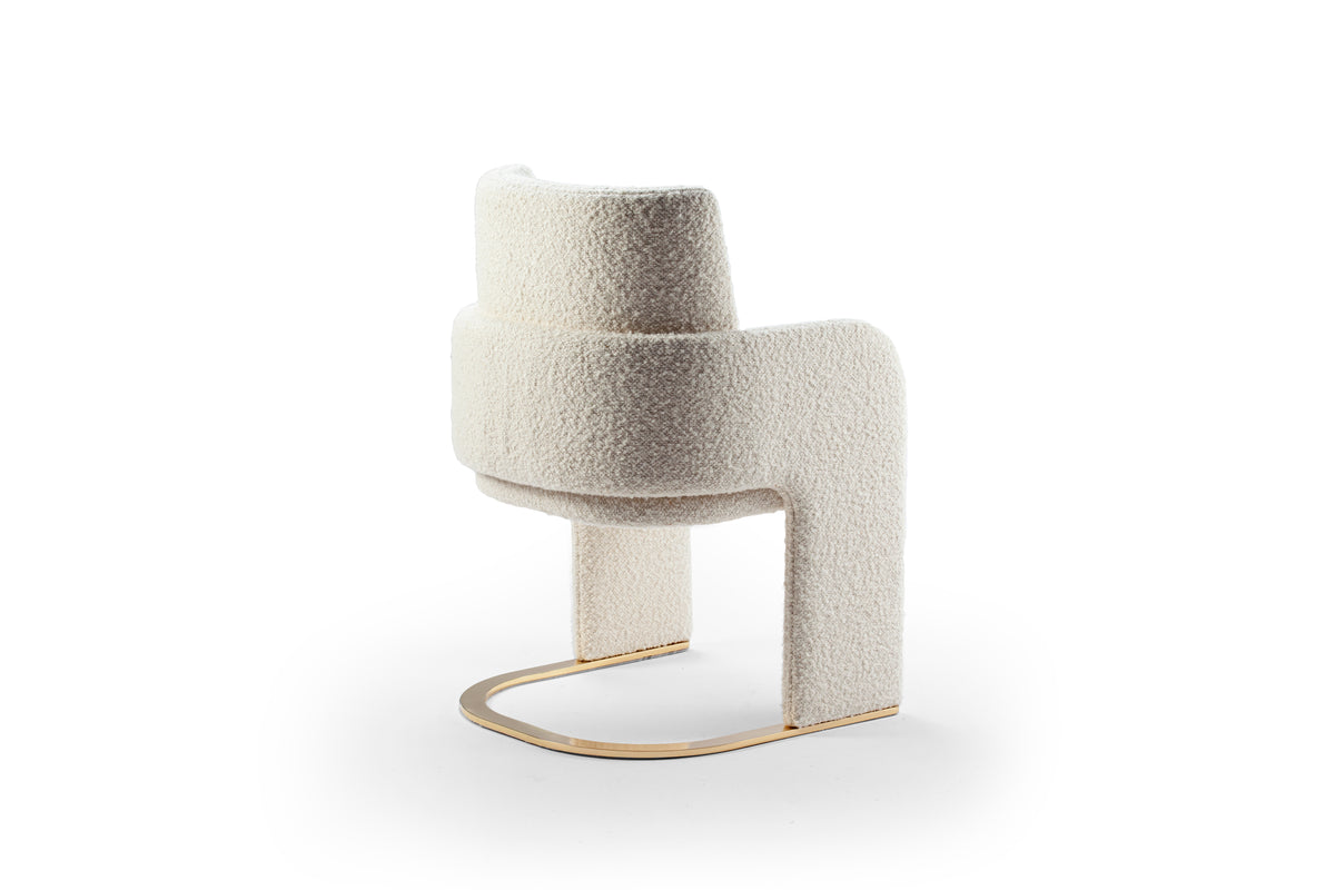 Odisseia Dining Chair in ivory bouclé, back three-quarter view with brass base