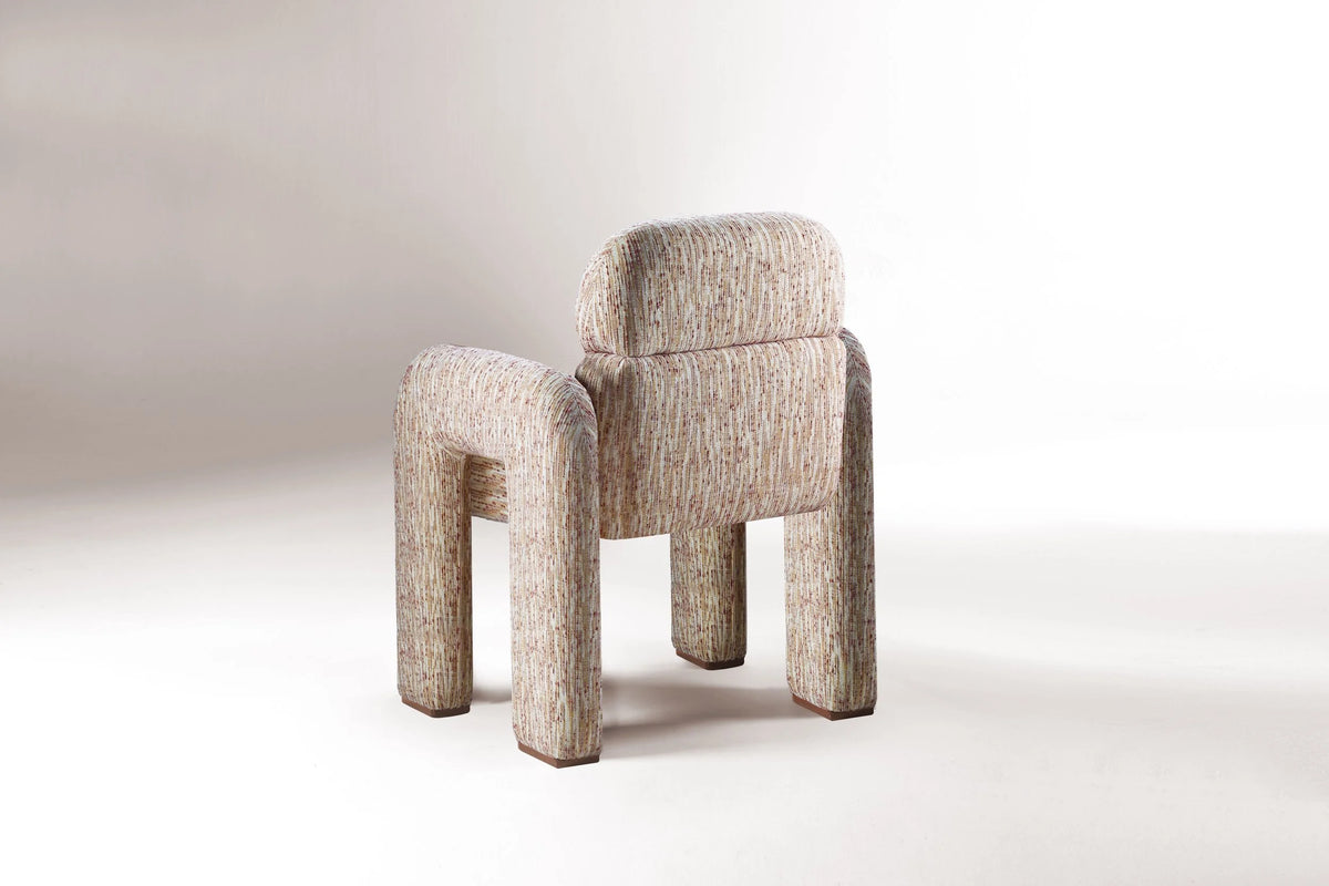 Vertigo Dining Chair back view showing curved backrest and walnut feet