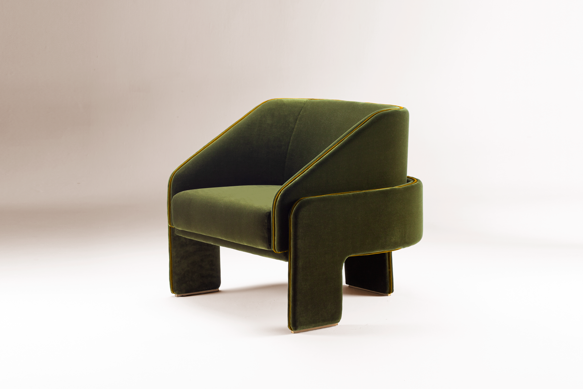 L’Unité Chair in olive green velvet on grey, angled view