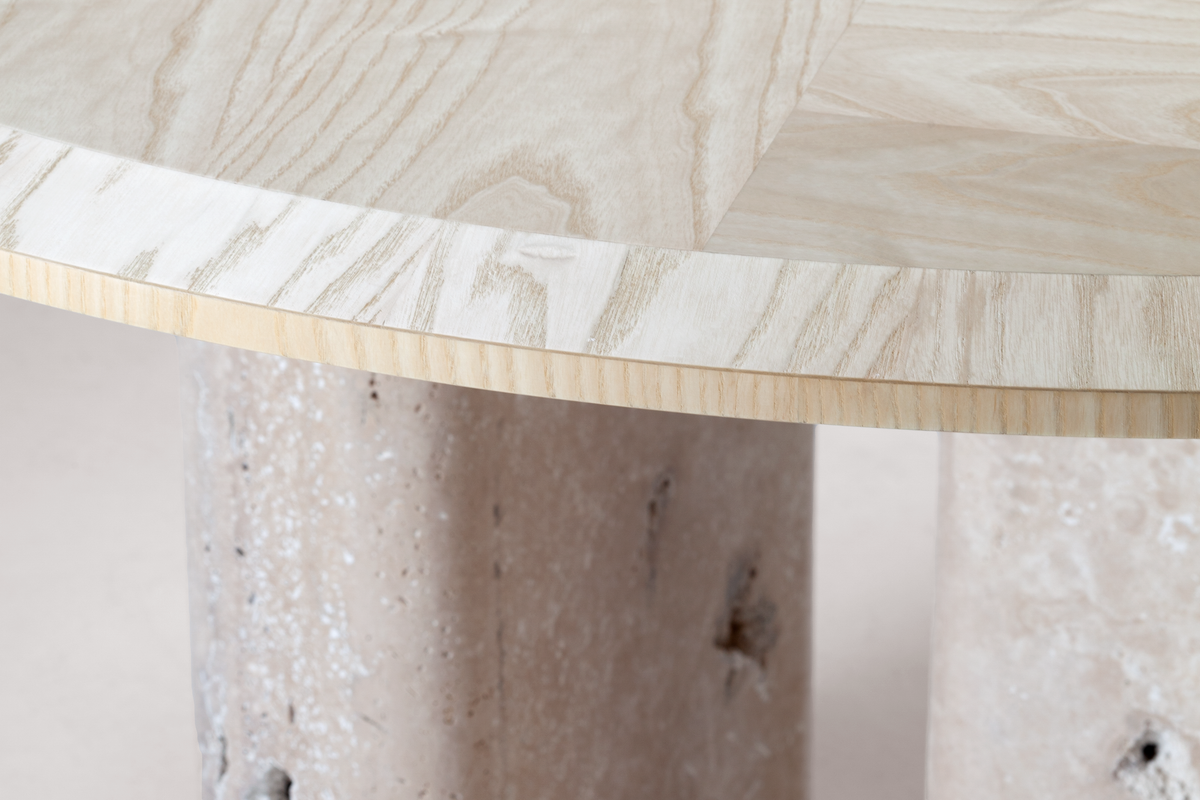 L 'Anamour Dining Table detail of the travertine pedestal under the ash top