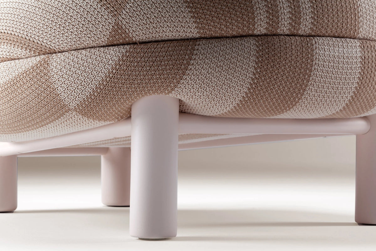 Aimi Lounge Chair, close-up of the striped seat cushion and pale wood leg