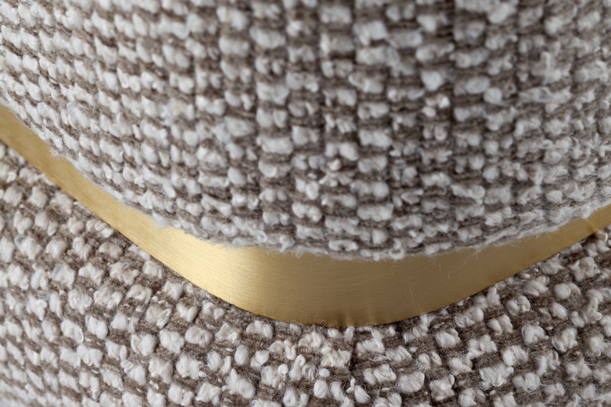 Panorama Armchair close-up of the brass band at the base of the weave upholstery