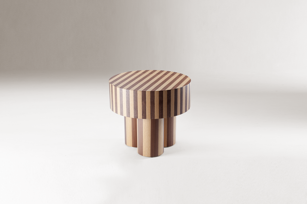 Nusa Side Table in striped two-tone wood, low three-quarter view