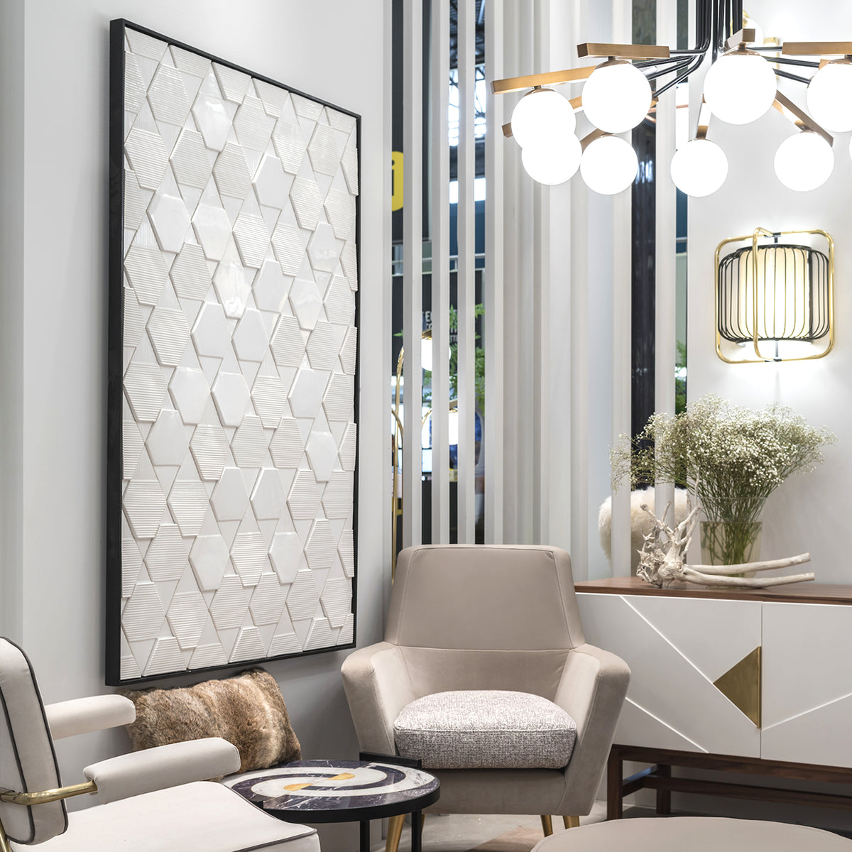 Tua Panel in white hung in a lounge with armchairs and a chandelier