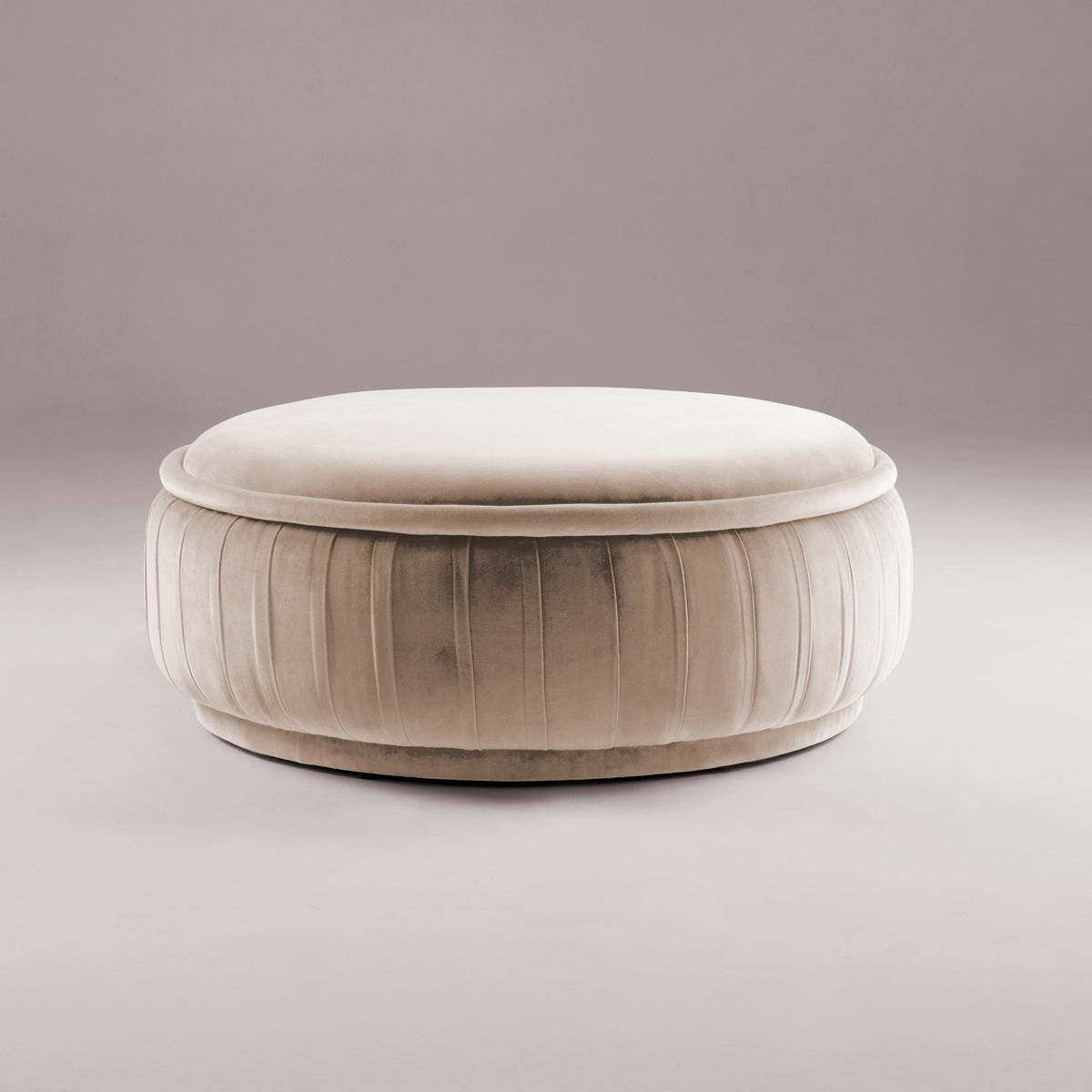 Malibu Ottoman in ivory velvet with pleated sides, front view
