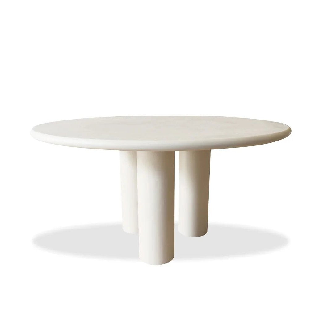 Elephant Dining Table, round ivory top on three column legs