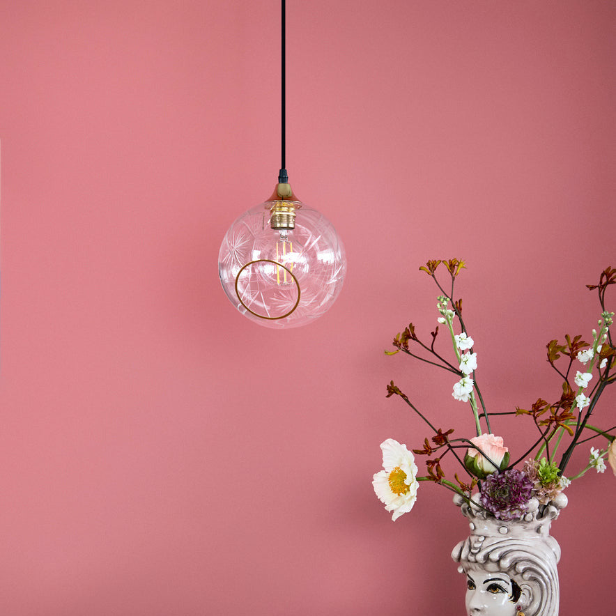 Ballroom Pendant Light in Diamond Cut glass with gold fitting against a pink wall