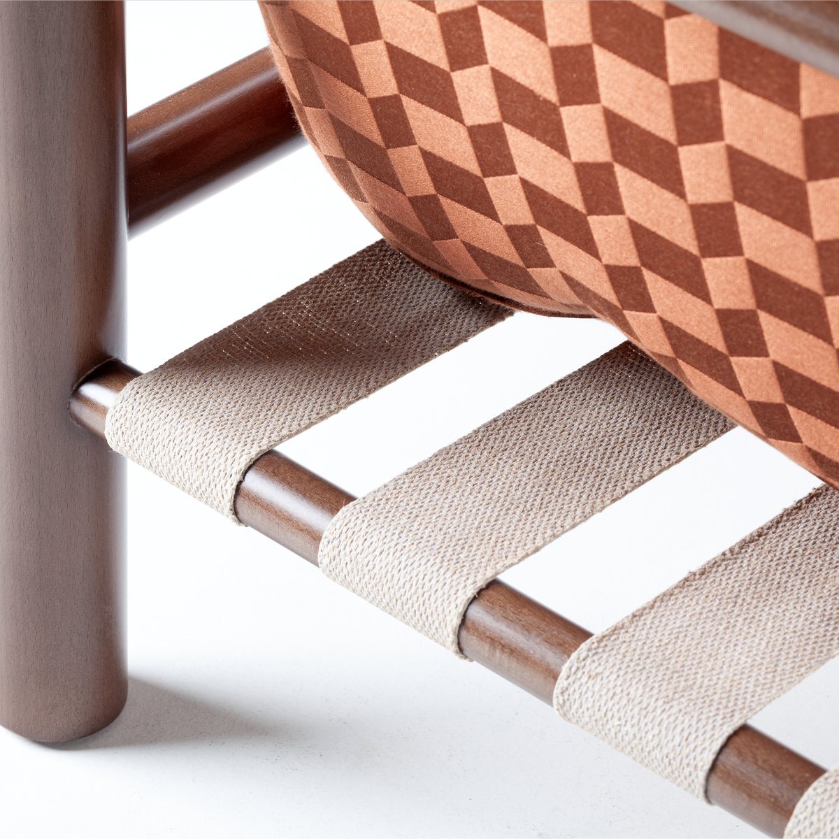 James Armchair close-up of cotton webbing straps under the rust cushion