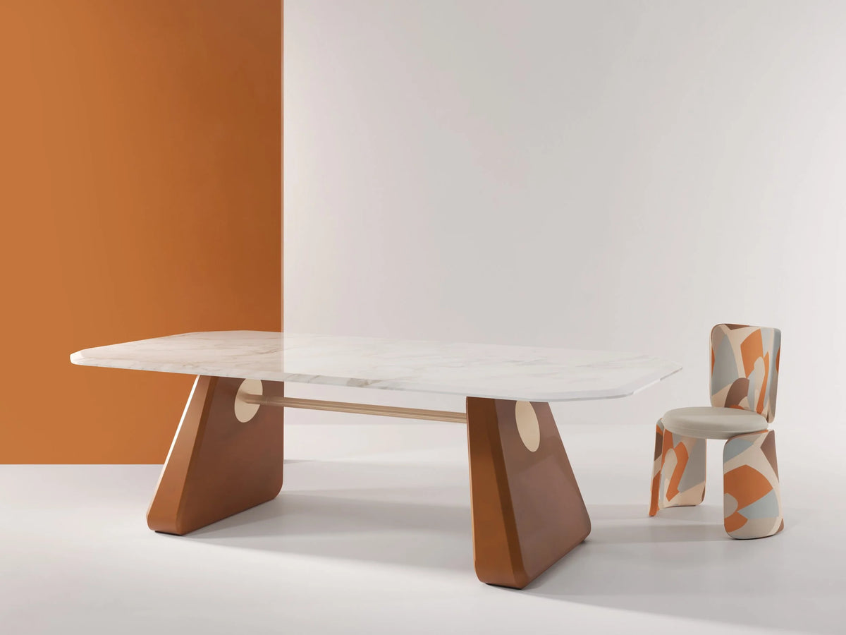 Inge Marble Dining Table with white marble top against a terracotta and white wall with a chair