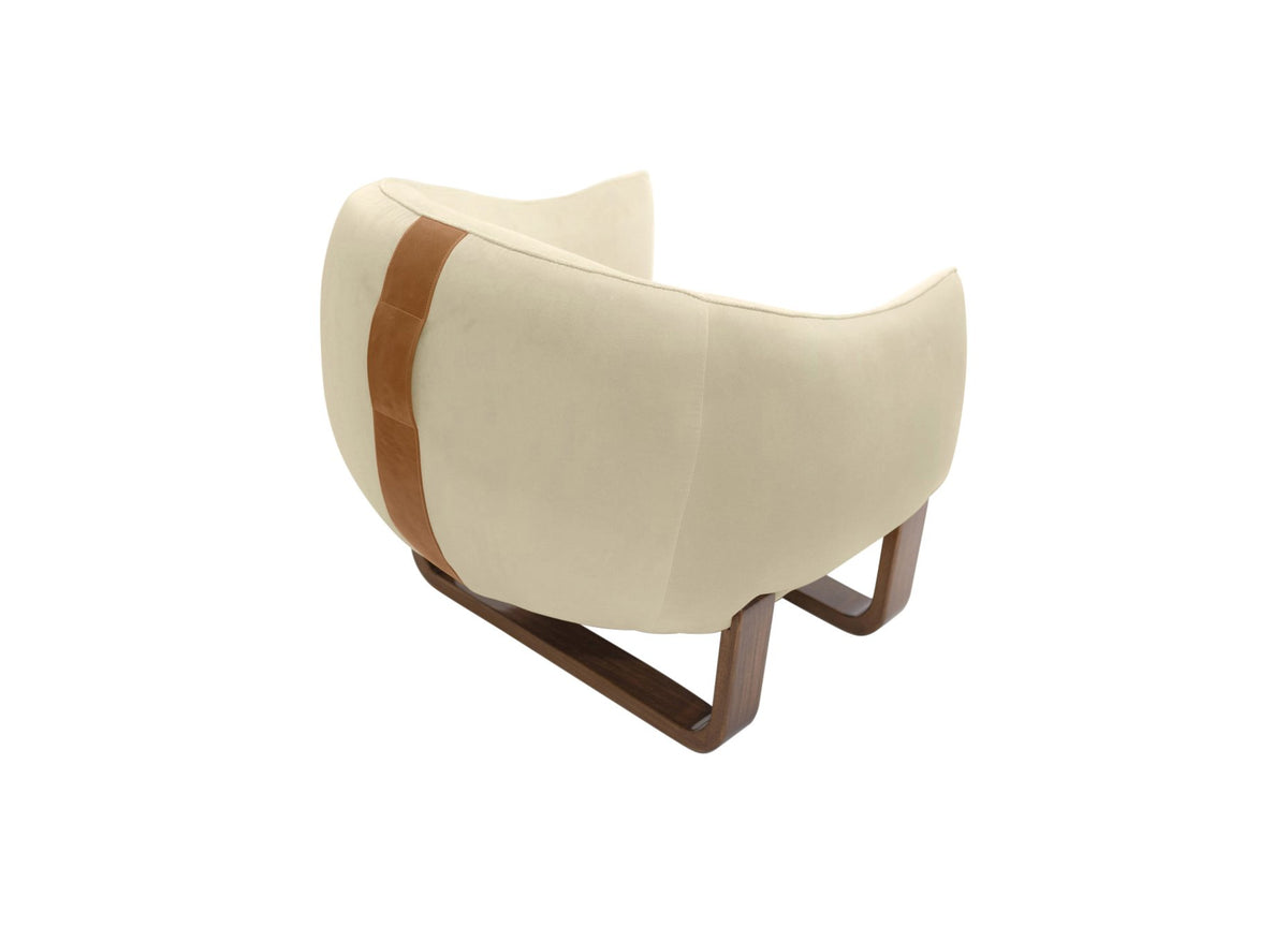 Milo Armchair back view in Shell Chesterfield velvet with leather handle