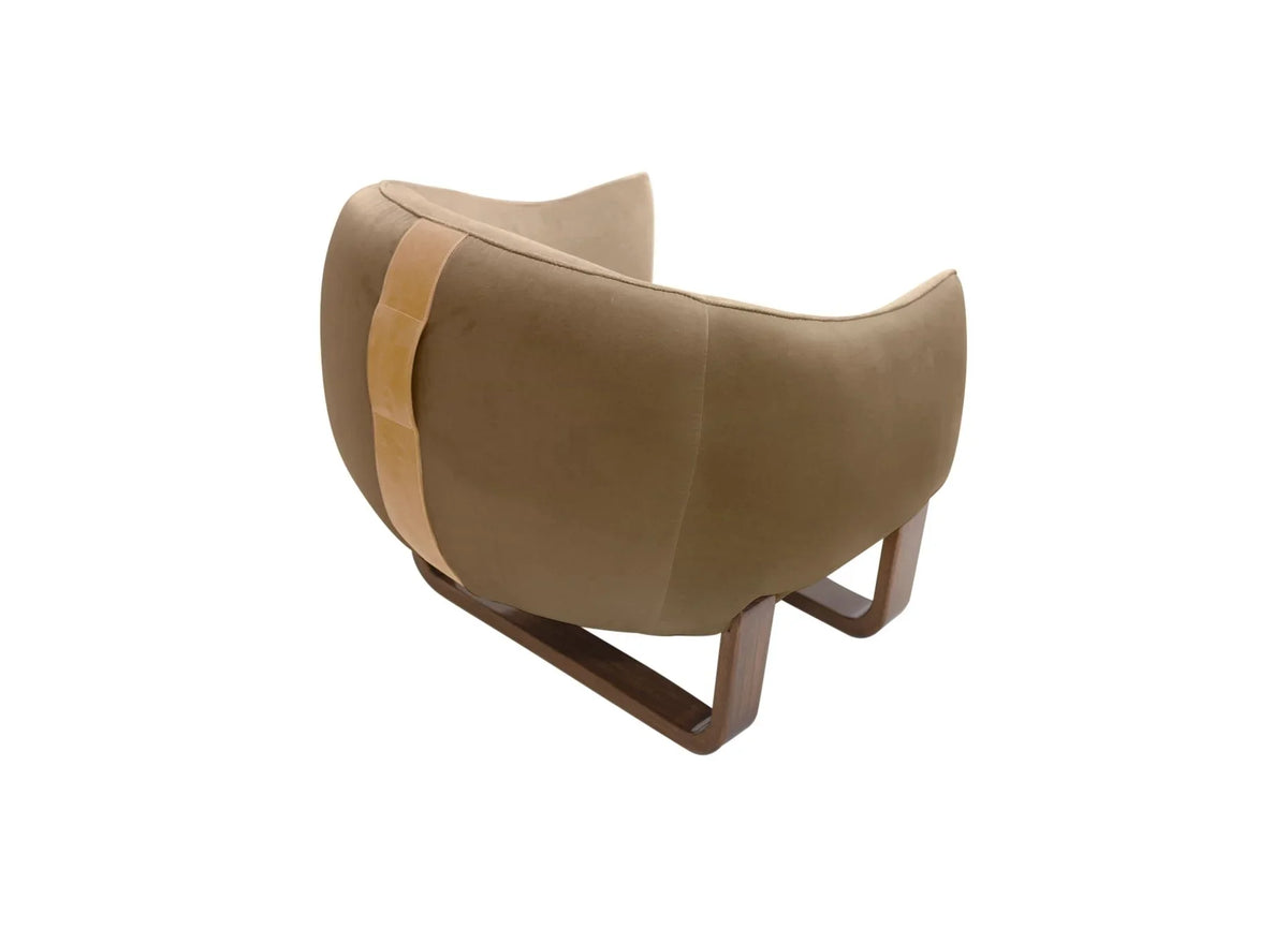 Milo Armchair back view in beige velvet with tan leather strap and metal sled base