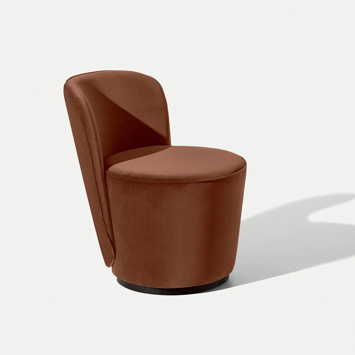 Opera Armchair in rust brown leather, angled view with shadow
