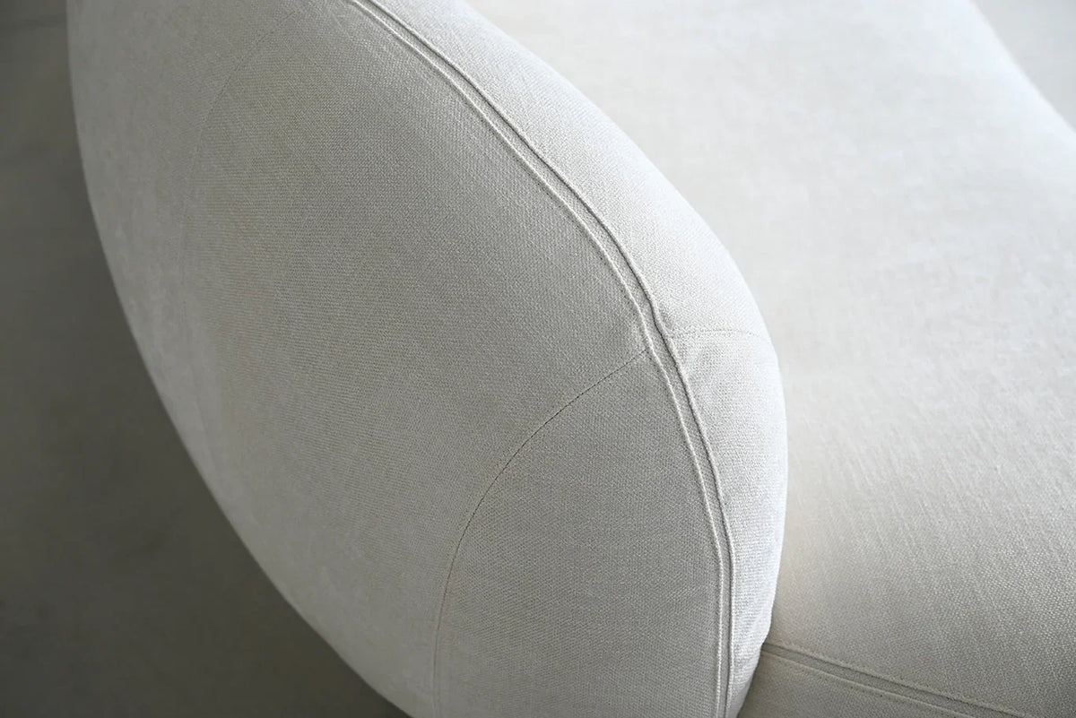 Moritz 2-Piece Sectional in Alabaster Boucle, detail of curved cushion seam