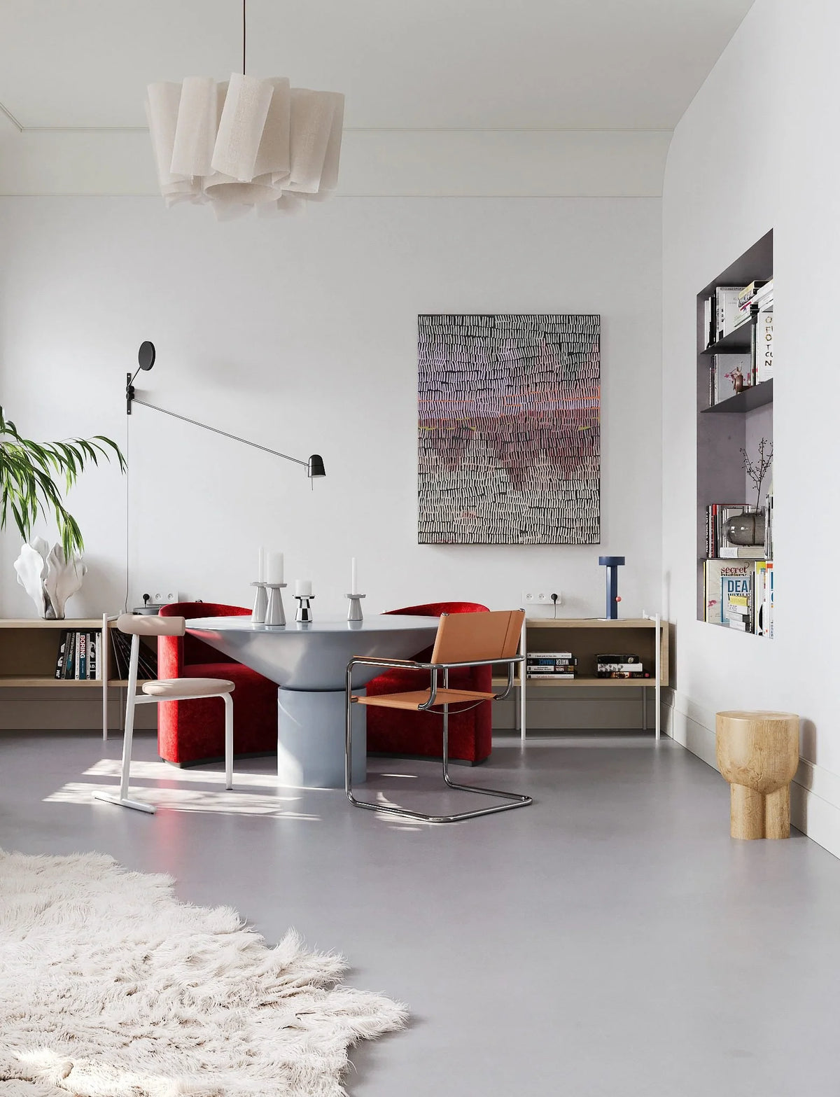 Silo Dining Table in grey lacquer in a bright room with a pendant light and wall art