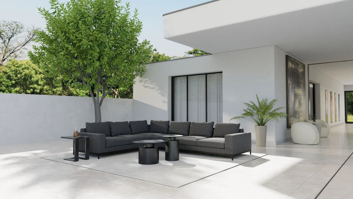 Rook Side Table in Matte Black on a terrace with a dark outdoor sectional