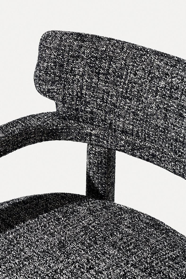 Zoe Armchair, close-up of the black and white speckled backrest and arm