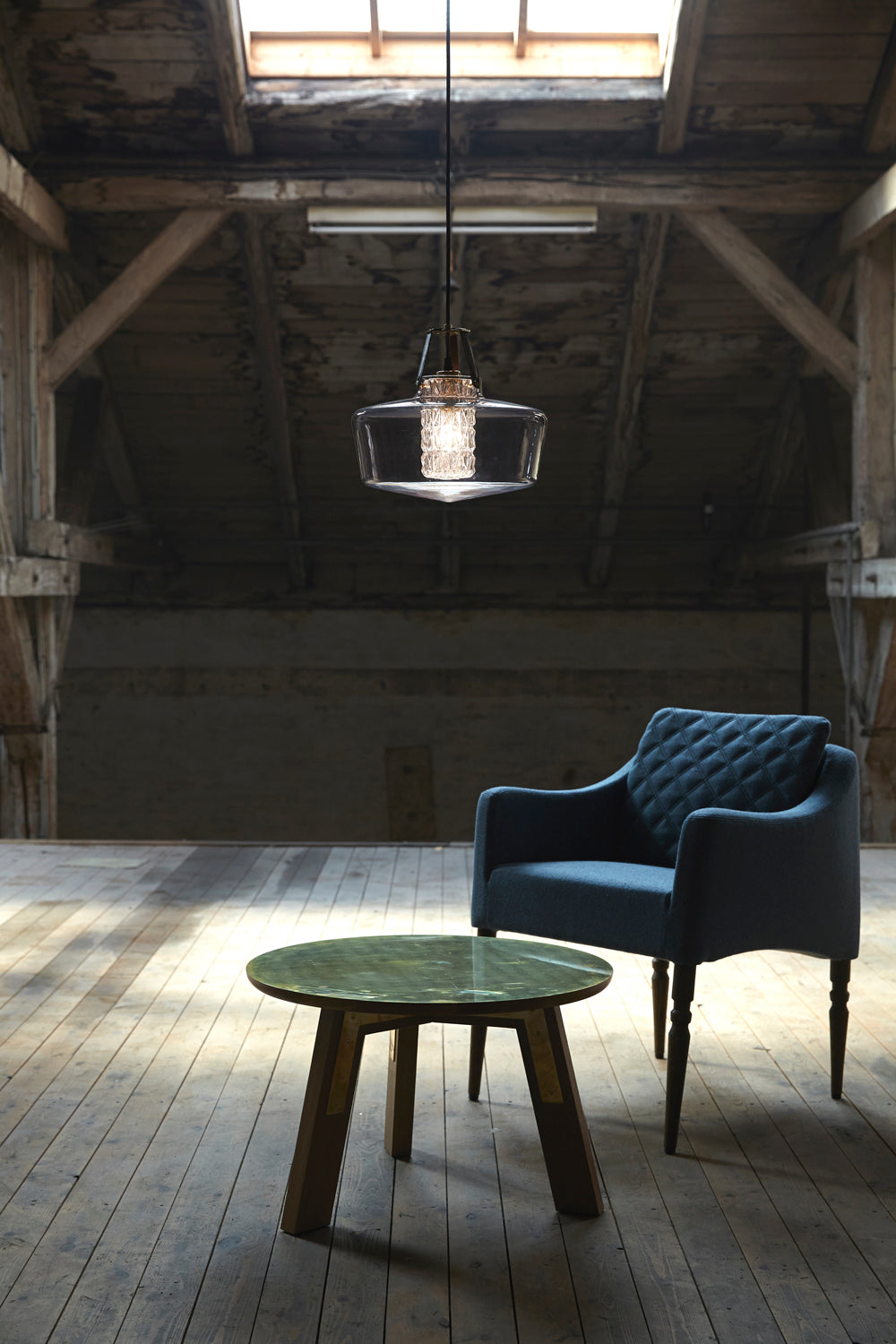 Addicted To Us pendant light in black hanging in a loft interior by Maison Burgos