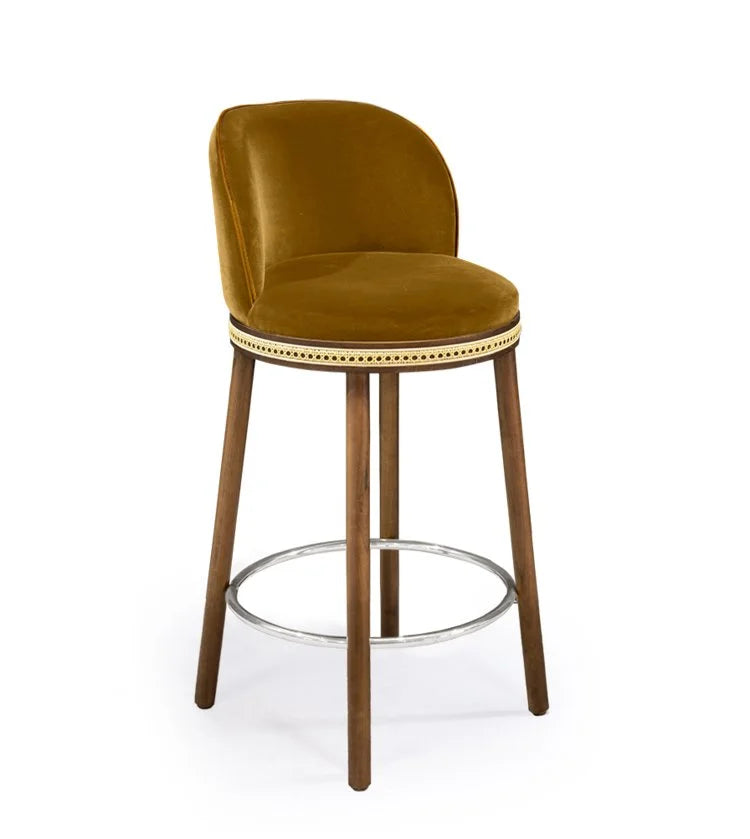 Alma Counter Stool in Dijon velvet with natural walnut legs and satin nickel footrest