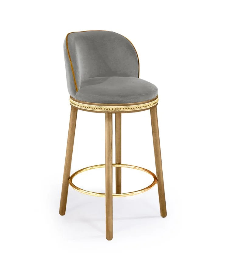 Alma Counter Stool in Fog velvet with natural oak legs and polished brass footrest