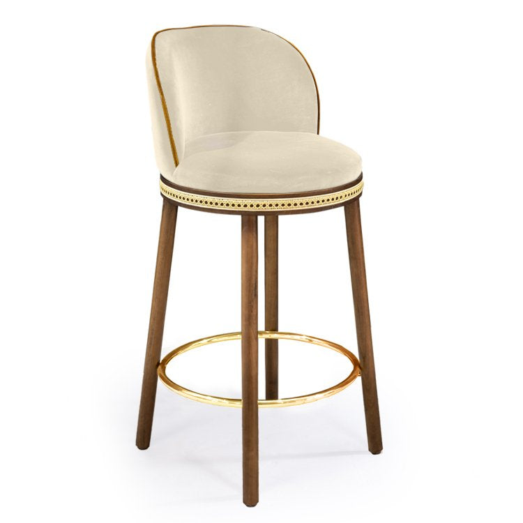 Alma Counter Stool in Nuage velvet with natural walnut legs and polished brass footrest