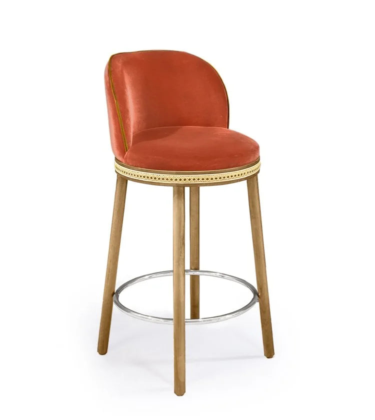 Alma Counter Stool in Papaye velvet with natural oak legs and satin nickel footrest