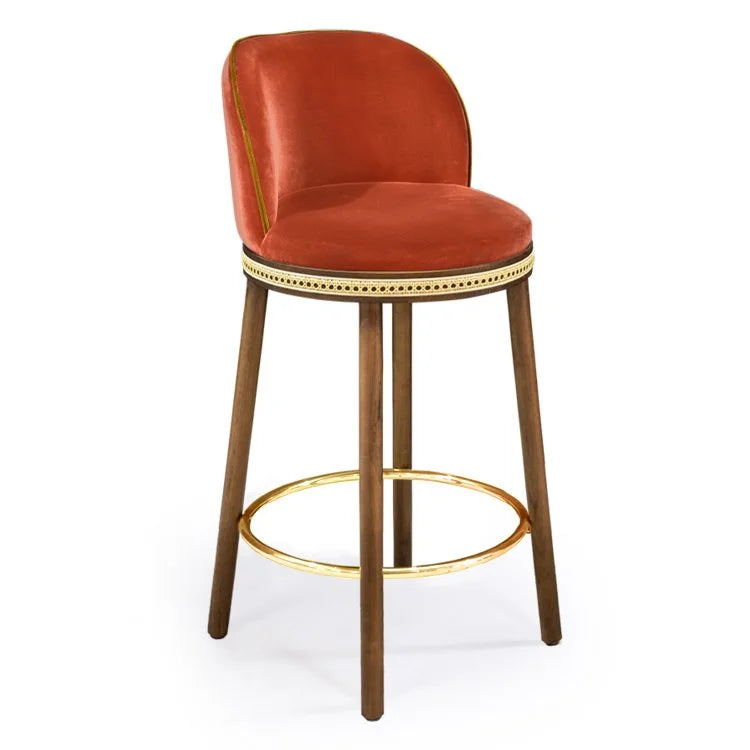 Alma Counter Stool in Papaye velvet with natural walnut legs and polished brass footrest