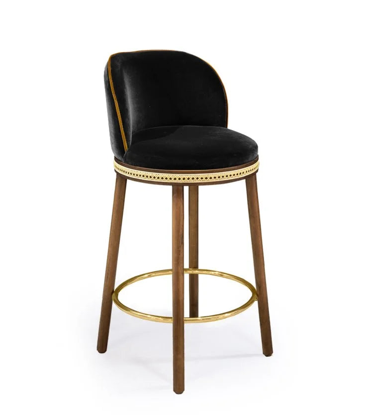 Alma Counter Stool in Simple Black velvet with natural walnut legs and satin brass footrest