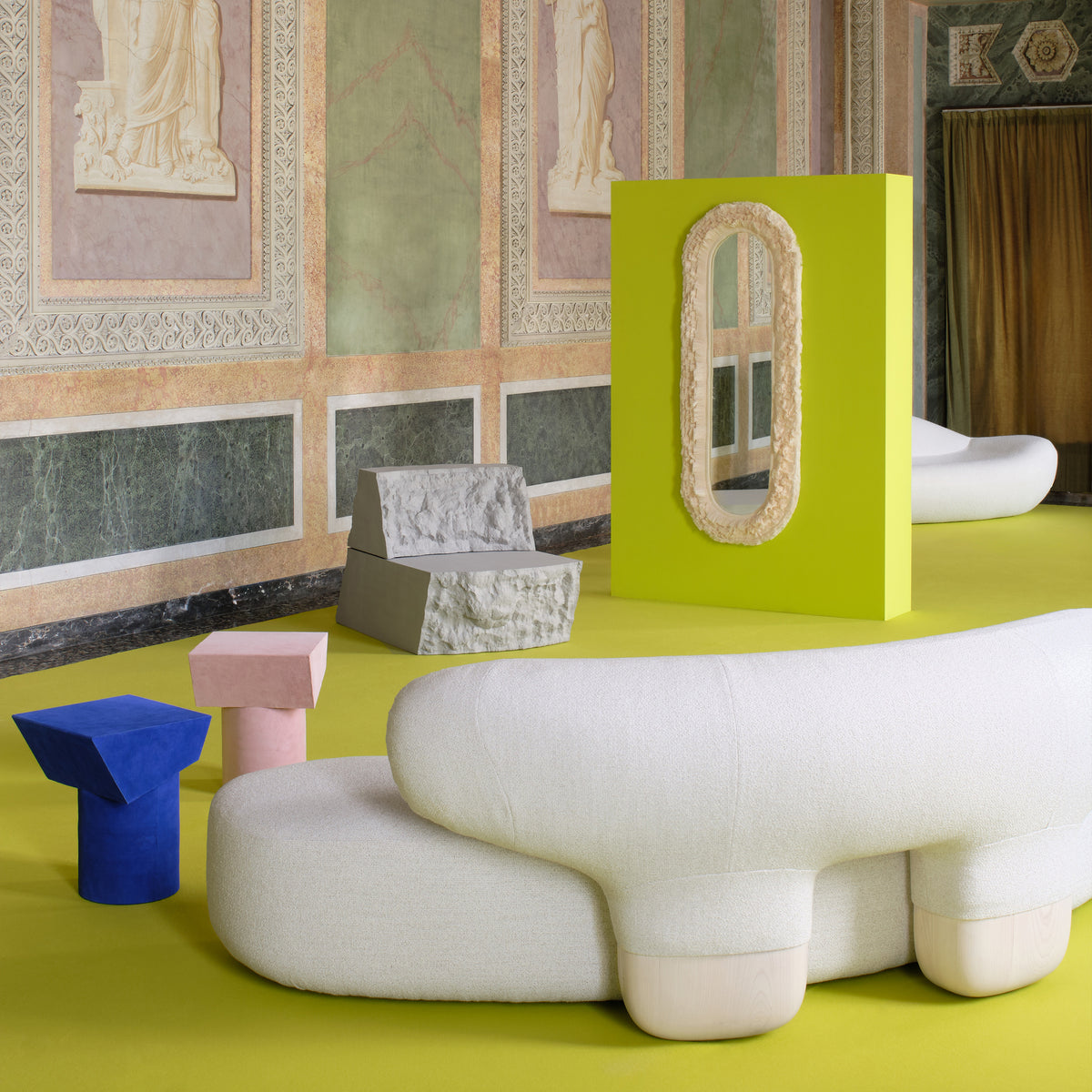 Asawa Sofa with lime-green screen and sculptures in a frescoed room