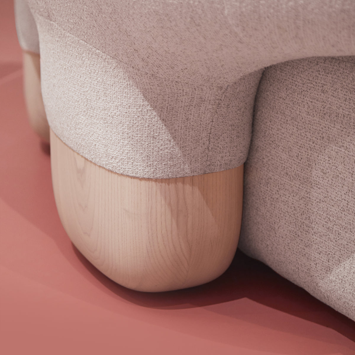 Asawa Sofa close-up of fabric meeting a pale wood foot