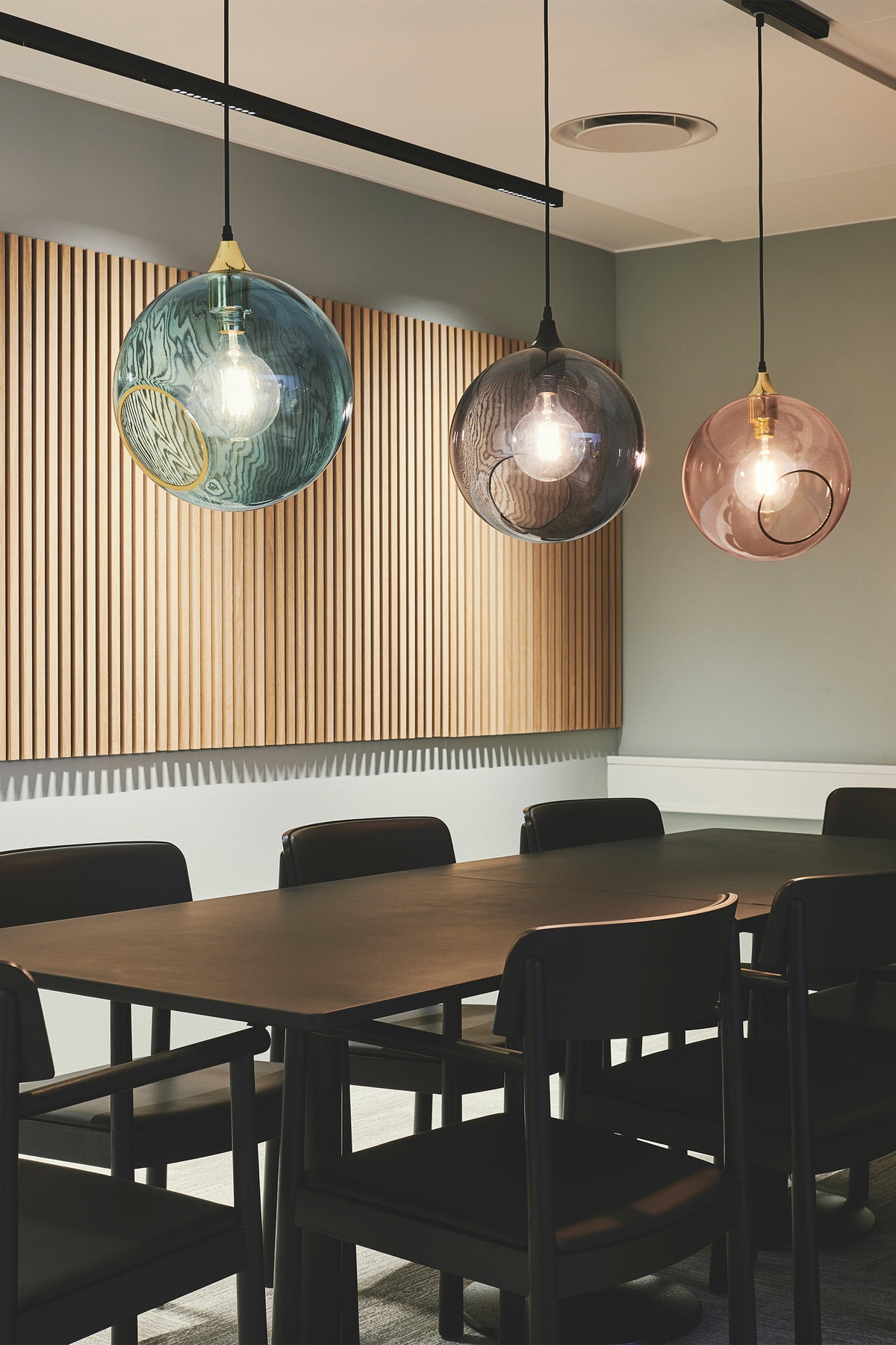 Ballroom Pendant Lights over a meeting table by Maison Burgos