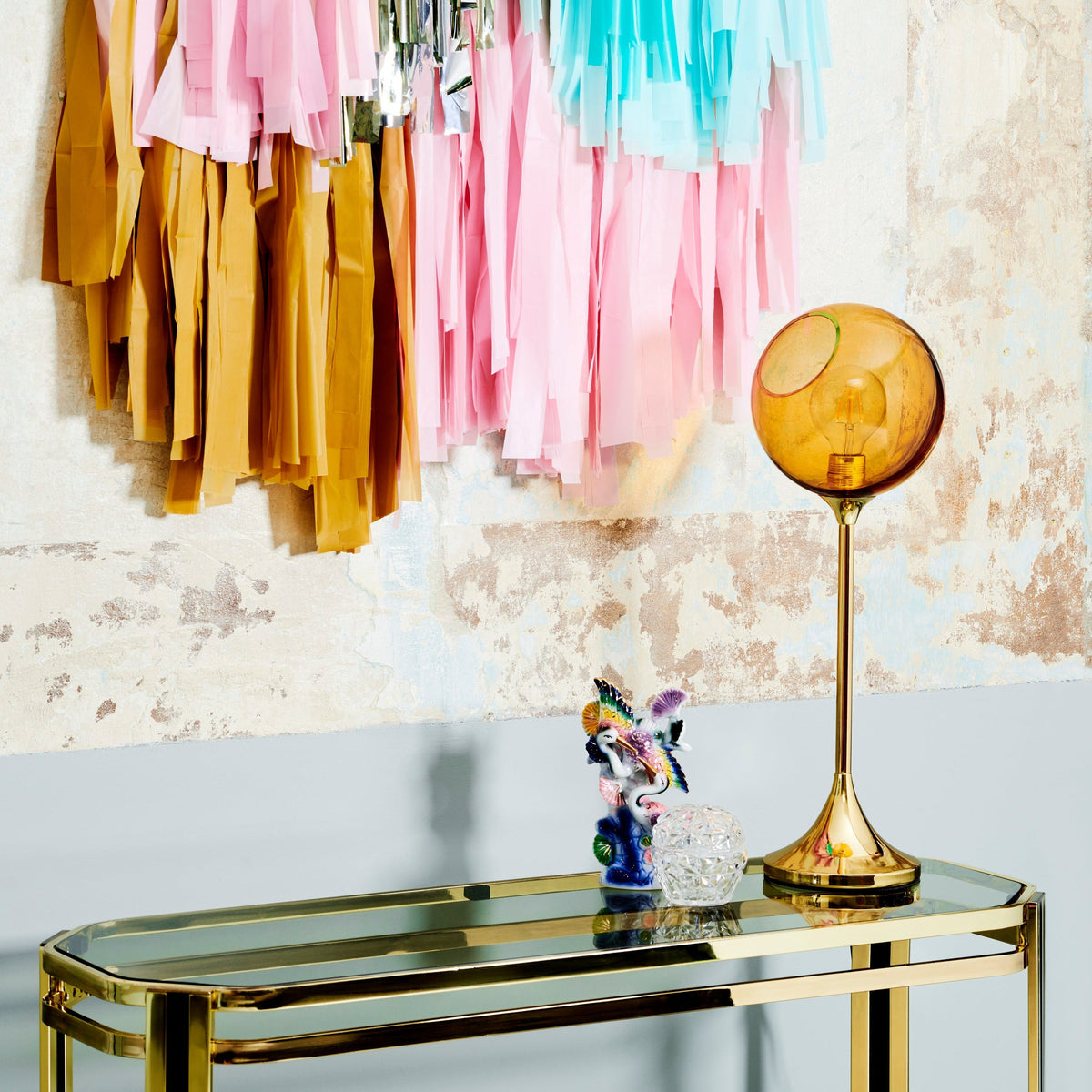 Ballroom Table Lamp in Amber glass on a brass console
