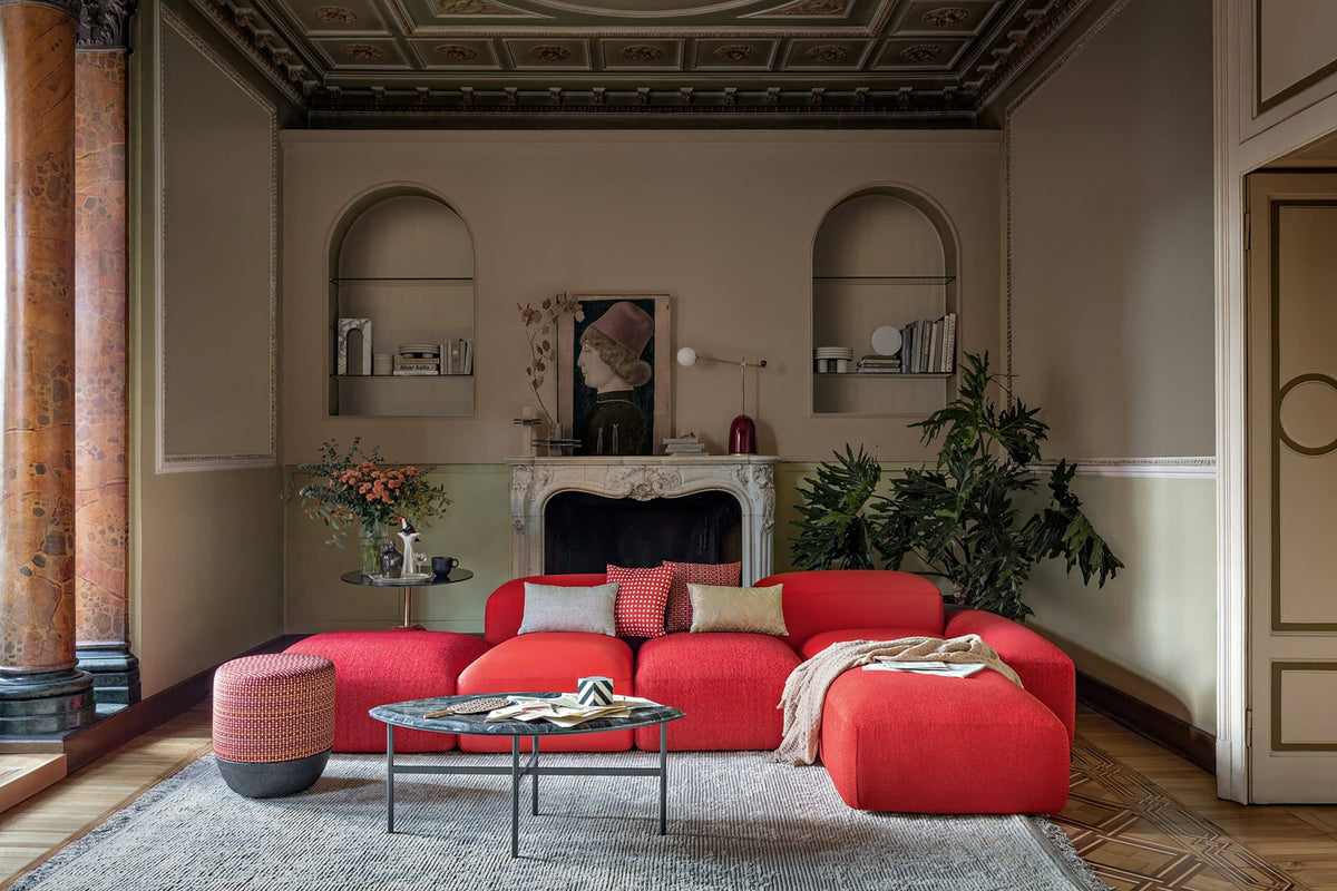 Book One & Two Coffee Table in a classic living room with a red sofa