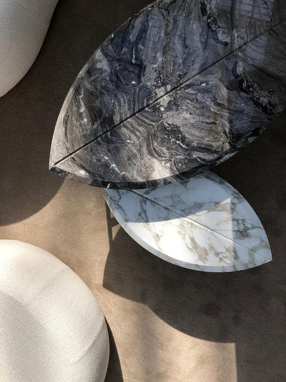 Book One & Two Coffee Table overhead view of dark and white marble tops