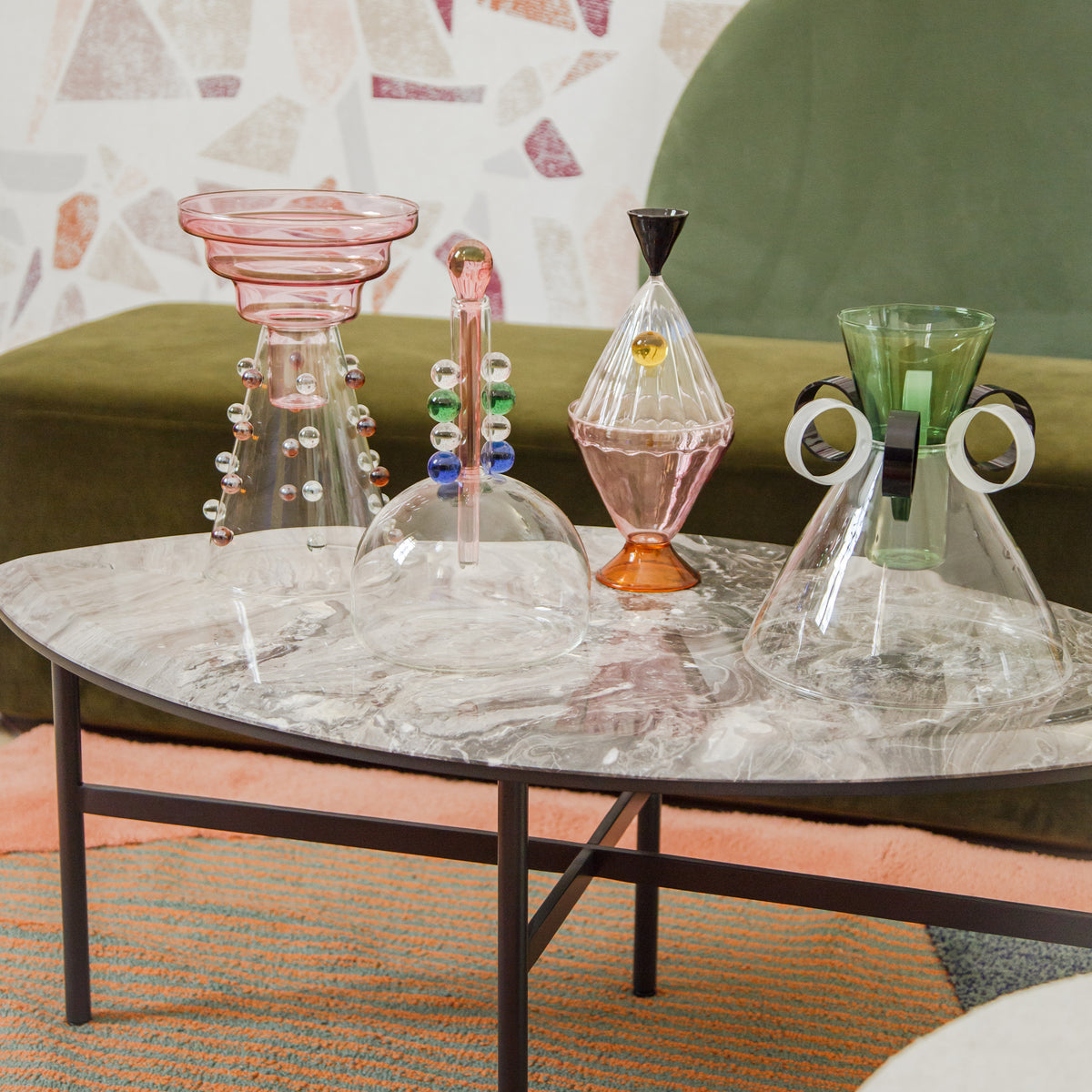 Book One & Two Coffee Table close-up with colourful glass vases