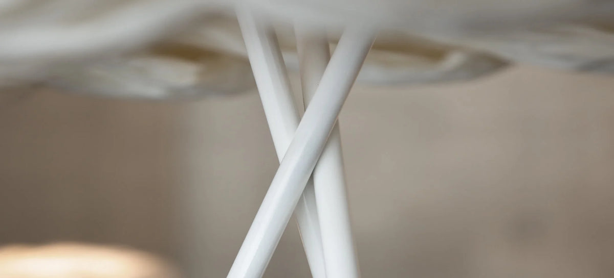 Mammalampa Bride Floor Lamp white tripod detail against a softly blurred background