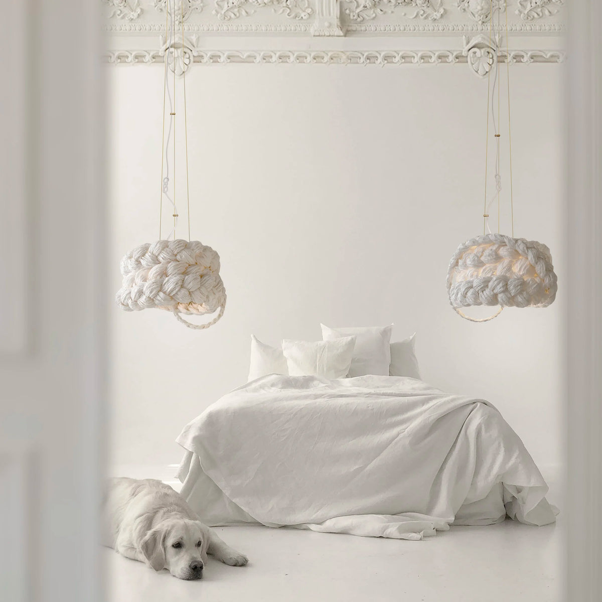 Mammalampa Bride Pendant Light White pair over a white bed with a dog on the floor